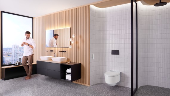 Homem na casa de banho Geberit ONE com Geberit AquaClean Mera e espelho Geberit Option Plus Homem na casa de banho Geberit ONE com Geberit AquaClean Mera e espelho Geberit Option Plus