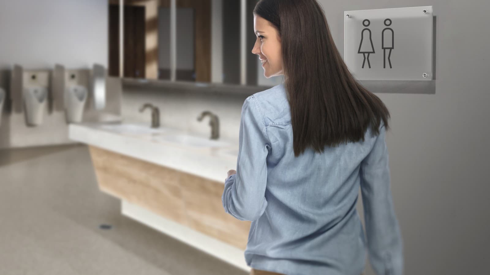 Uma jovem de cabelo escuro numa casa de banho pública Uma jovem de cabelo escuro numa casa de banho pública
